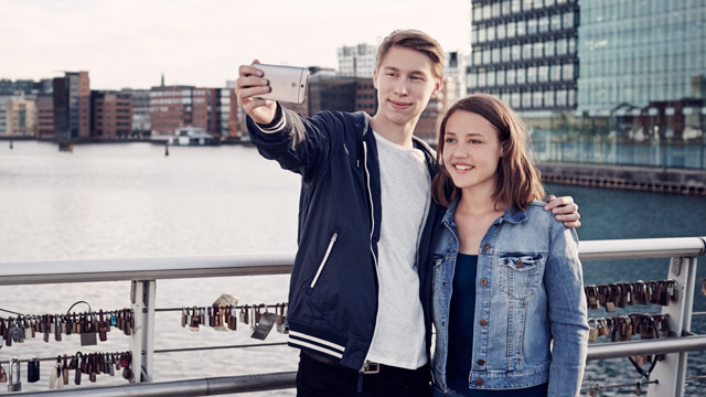 Small - Young couple taking selfie city