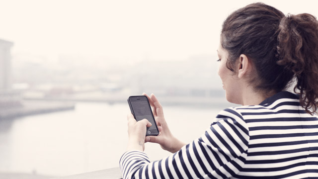 Woman texting outside SMALL