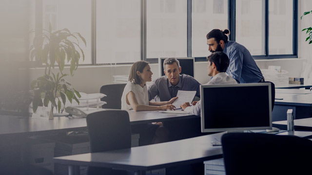 people having a meeting in open office space small overlay