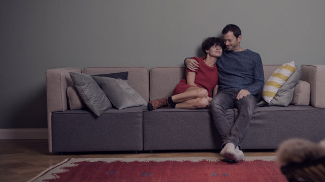 couple sitting on couch small overlay