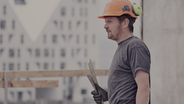 construction worker at building site small overlay