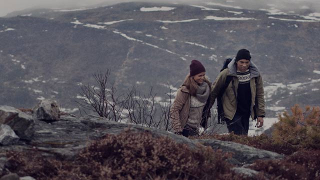 couple hiking in mountains small overlay