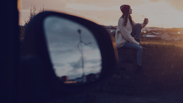 young woman at her car small overlay