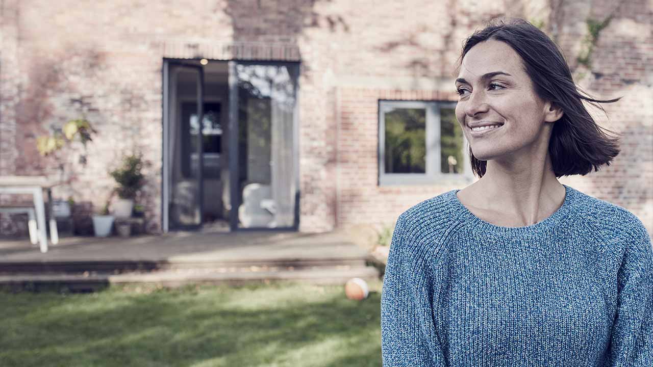 woman in front house right