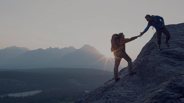 Couple hiking on a mountain - small